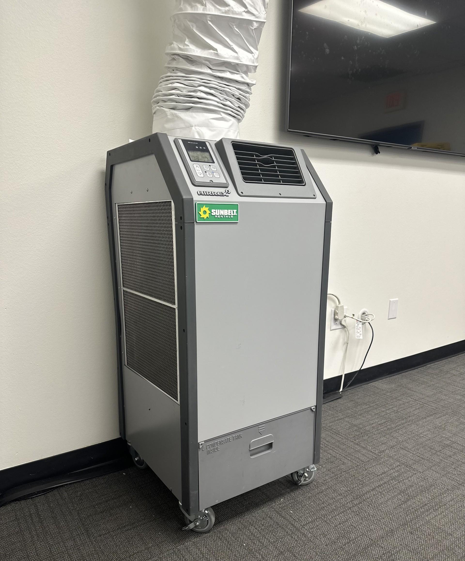 A spot cooler installed inside of a building .